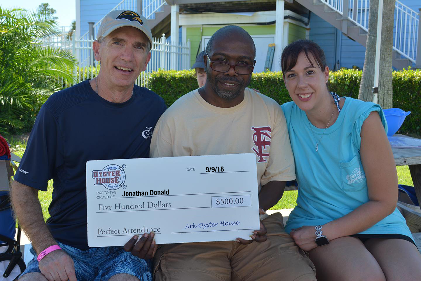 General Manager, Jim Harrison with perfect attendance winner Jonathan Donald and HR Generalist, Joie Sullivan.