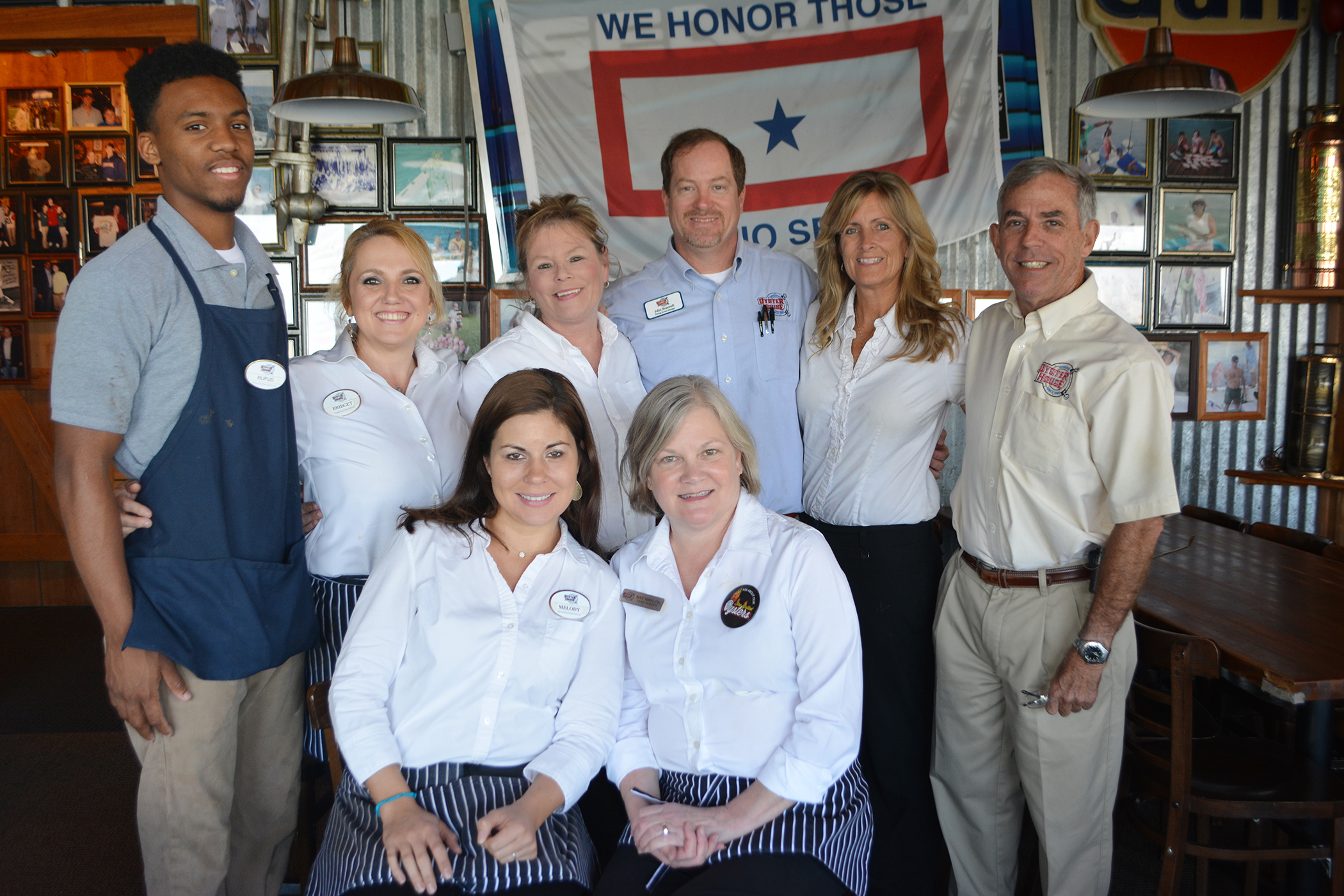 Rufus Young, Bridgette Knaebel, Tracy Tureau, John Braswell, Karen Taubel and David Dekle, co-owner of the Original Oyster House; from left sitting are Melody Tart and Kay Naylor.