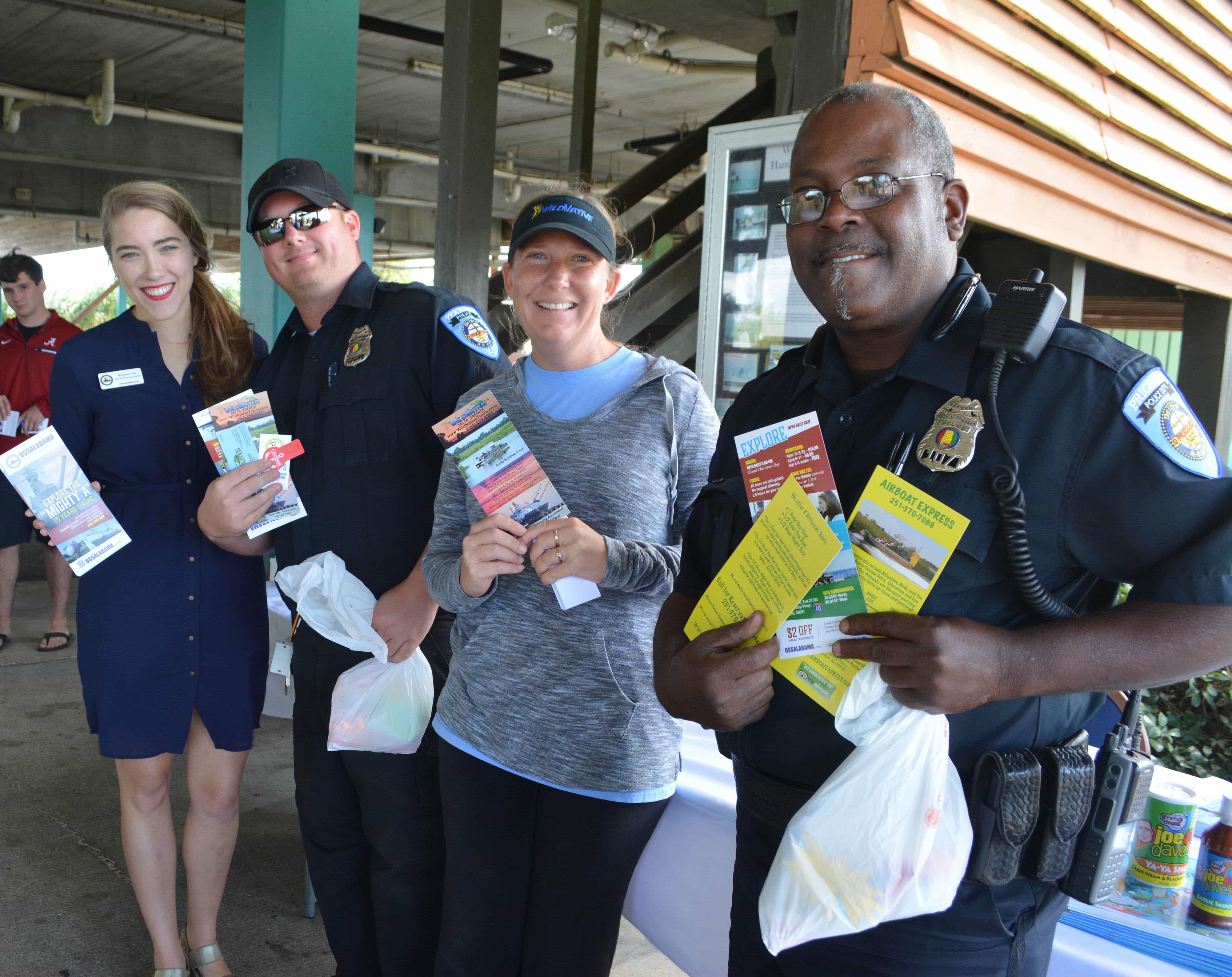 City of Prichard police officers stand with local vendors