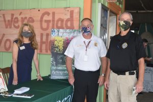 Pictured at the Never Forget Lunch are Sally Ericson, Bellingrath Gardens, Chief David Carpenter, and Captain Judson Beedy, Daphne Police .