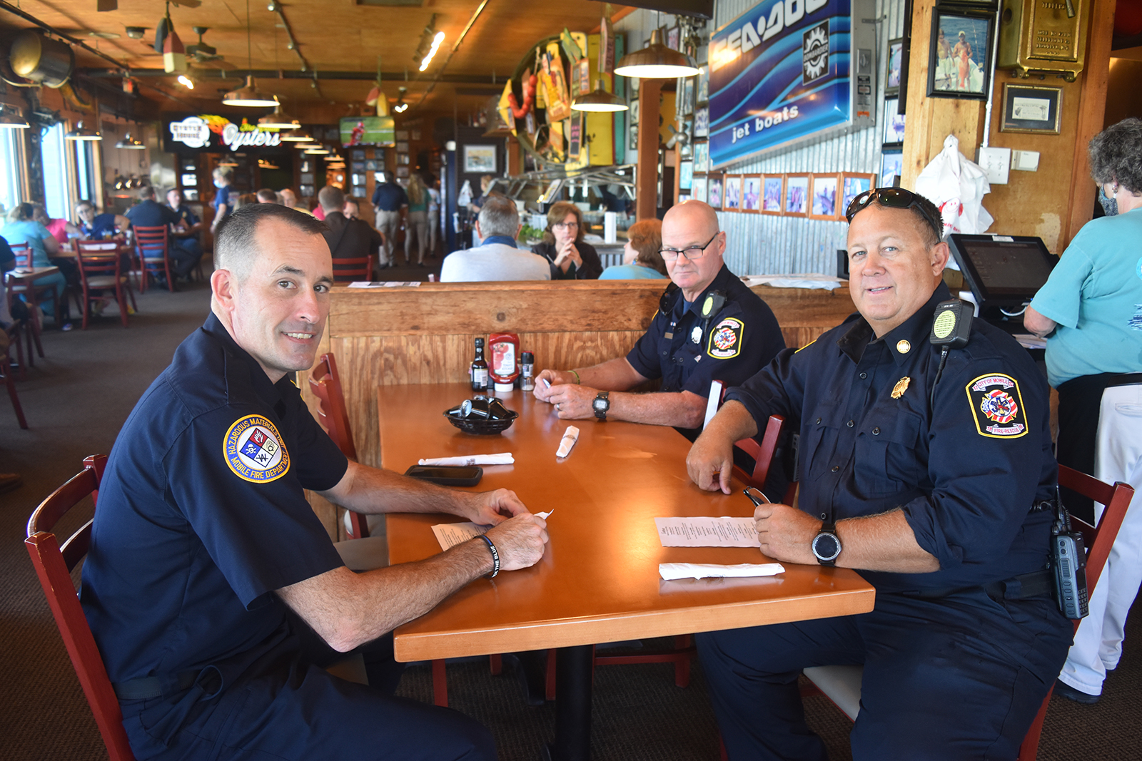 2021 Never Forget Lunch first responders eating at table