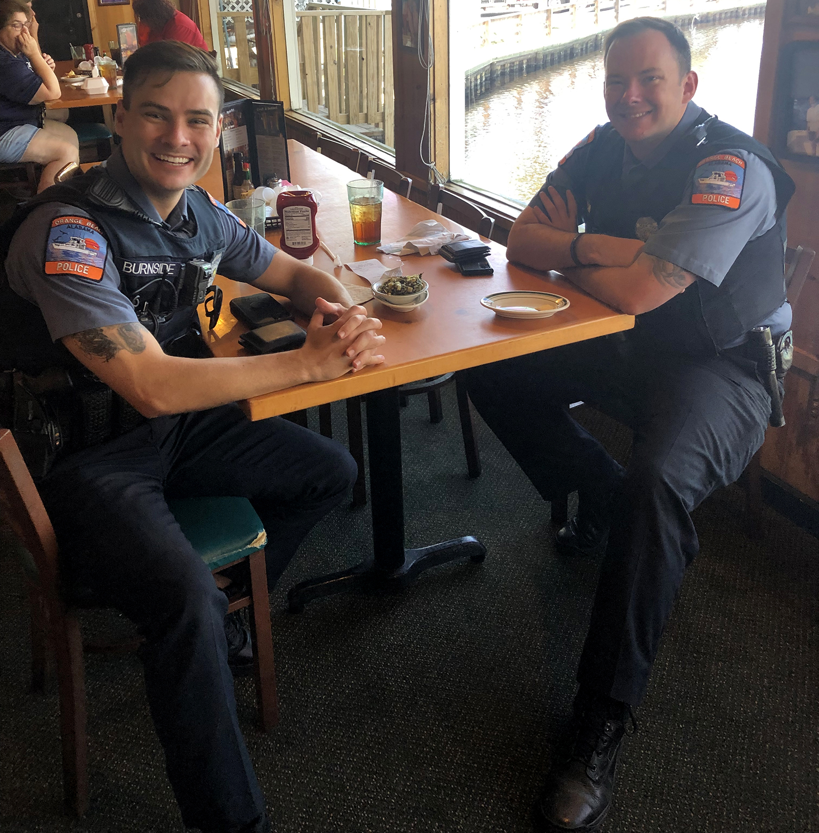 2021 Never Forget Lunch first responders at table in Gulf Shores
