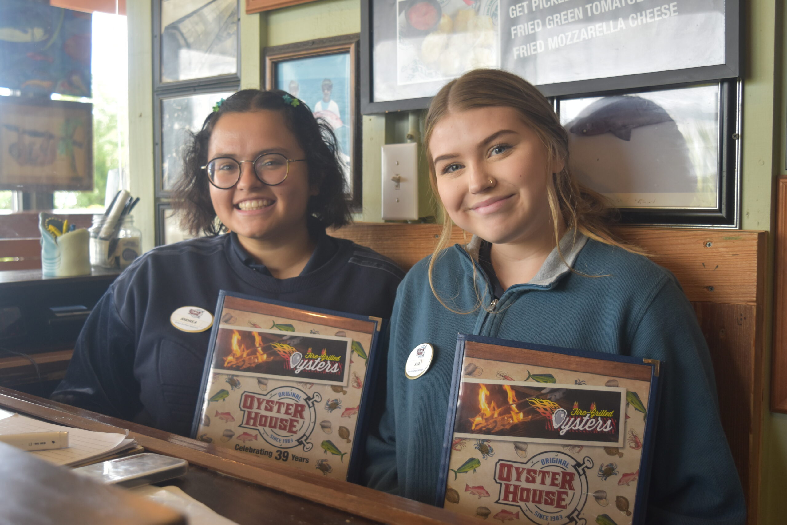 Host/Hostess Now Hiring photo of two hostesses with menus