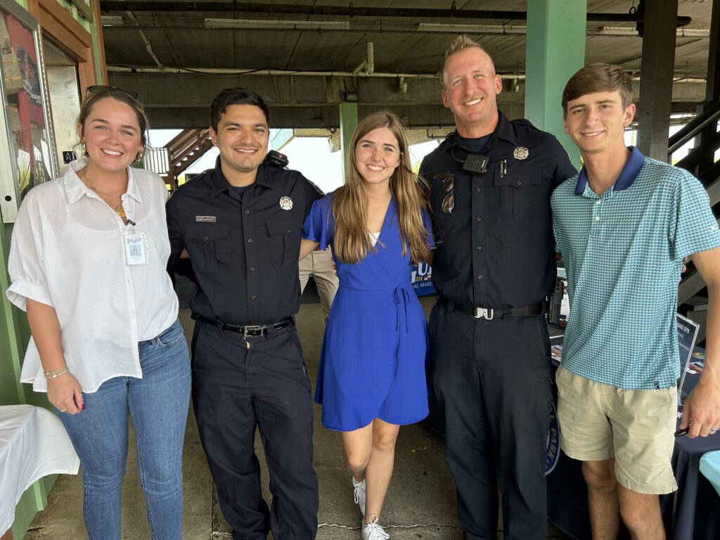 Attractions including OWA Parks & Resorts and ALABAMA Battleship Memorial Park greeted our first responders with discounted tickets, branded swag and huge thanks. Pictured from left are Jessa Tinelli (OWA), Fireman, Ashleigh Milne, (Battleship Alabama) Fireman, and Cody Tavernier (OWA).
