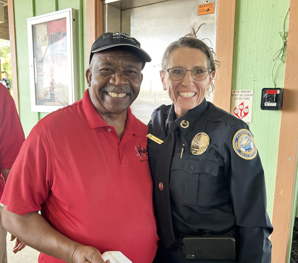 Walter Calhoun (Visit Mobile) thanks Chief of Police Lieutenant Stephanie Hollinghead for her service as a first responder at the 16th Annual Never Forget lunch.