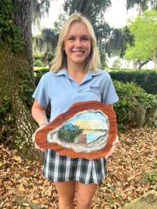 Mary Katherine Crowell shown with her scholarship winning artwork.